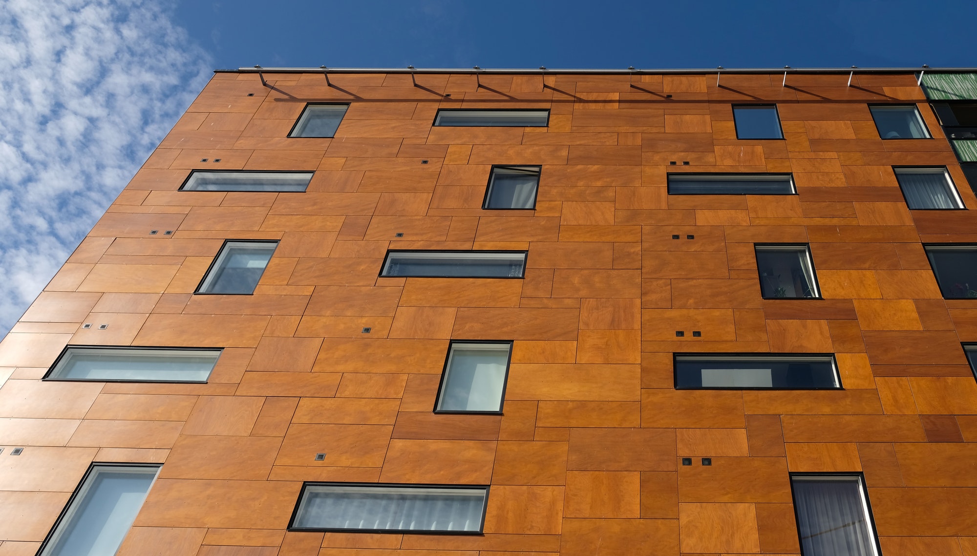 Exterior of modern brown house object. Architectural detail of a skyscraper, close-up on the windows